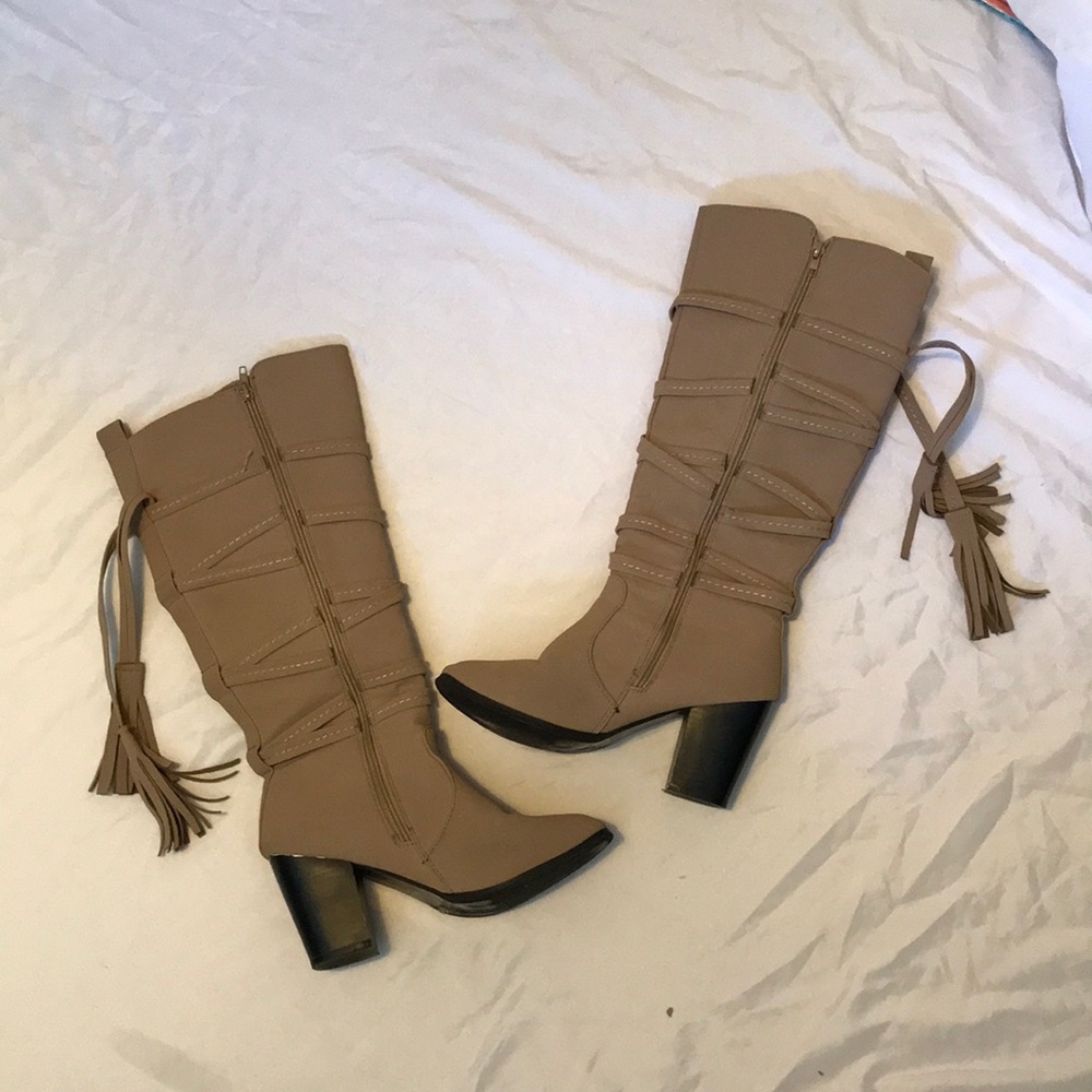 Brown knee high boots.